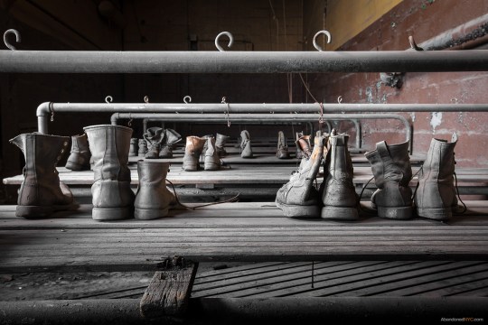 Work boots left behind in a water basin have been lovingly arranged by previous visitors to the 