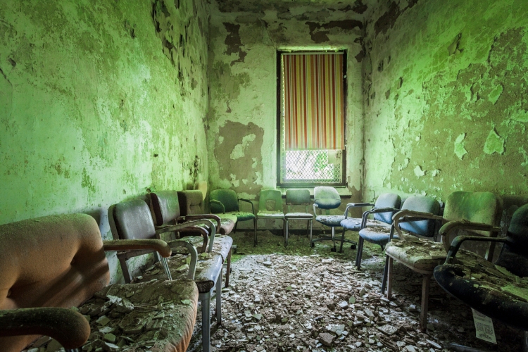 The chairs in this room were undoubtedly arranged by a previous visitor to the abandoned hospital.